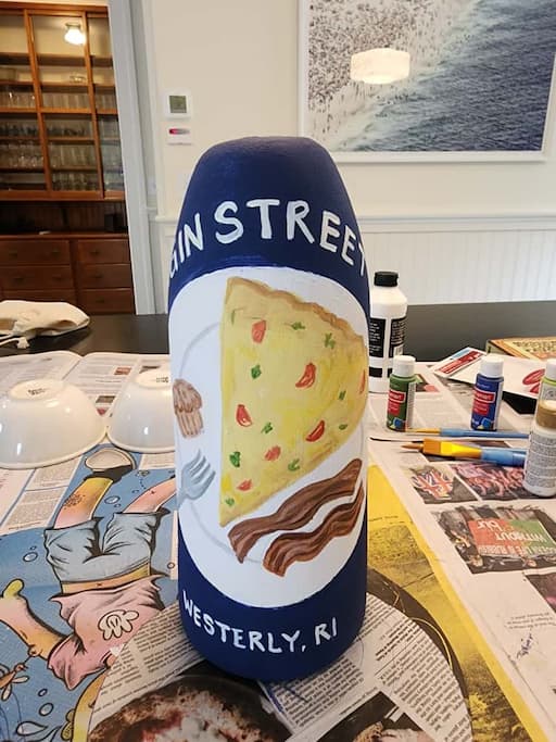 The 2024 Margin Street Inn buoy painted for the Stonington Lobster Pot tree