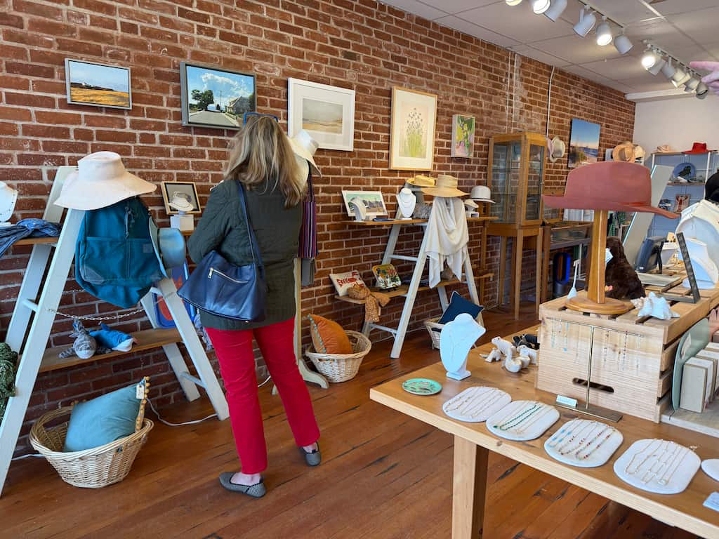 A woman shopping at a boutique store in Westerly, RI