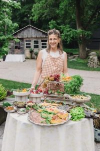 A caterer serving food at a a bridal shower at our New England bed and breakfast