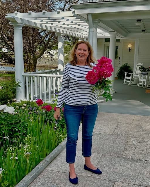 Our innkeeper at our New England bed and breakfast picking fresh flowers from the garden