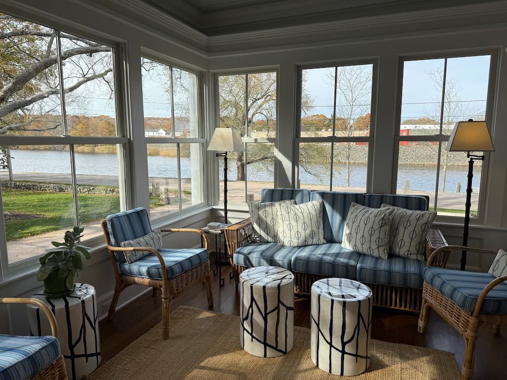 The sun porch at our New England bed and breakfast with views of the Pawcatuck River